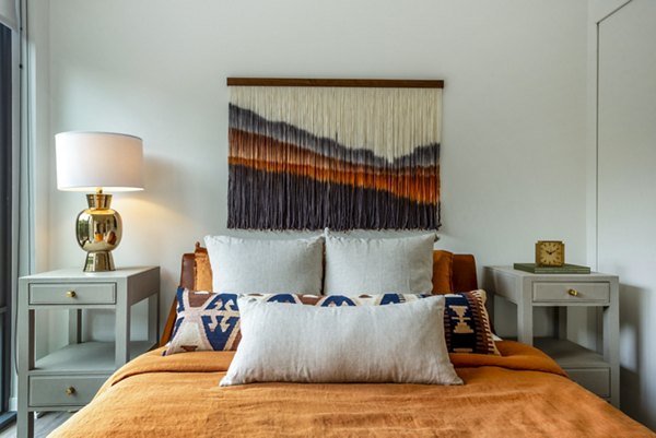 Cozy bedroom with a stylish bed and modern decor in luxury apartments