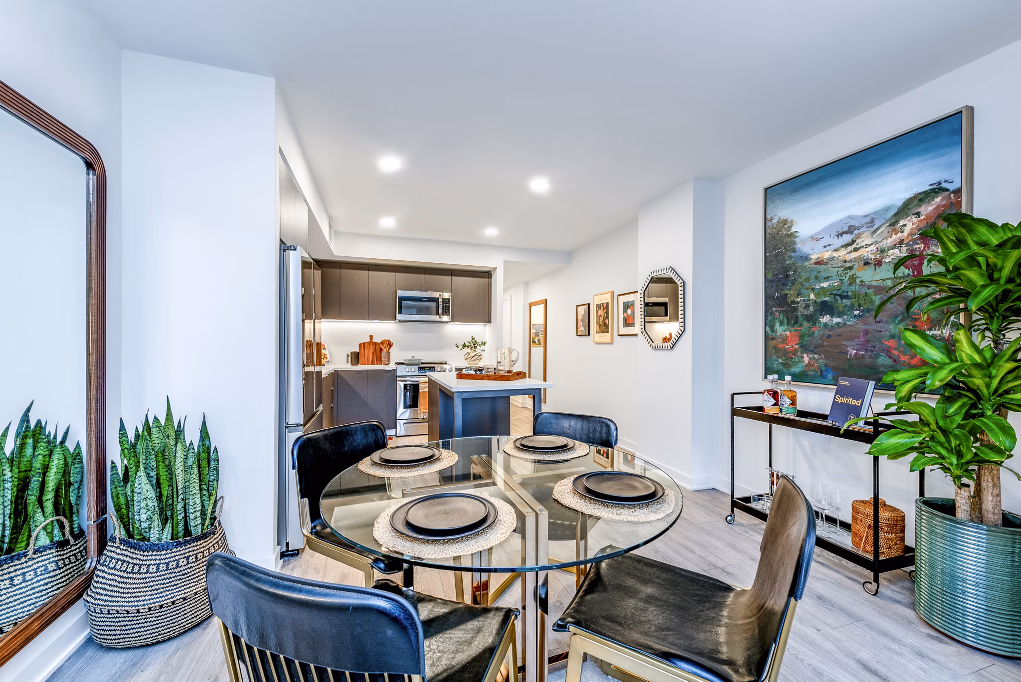 Contemporary dining area with a glass table and stylish chairs in luxury apartments