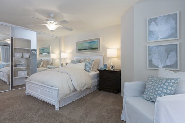 Cozy bedroom with modern furnishings at Barcelona Apartments in Greystar's luxury community