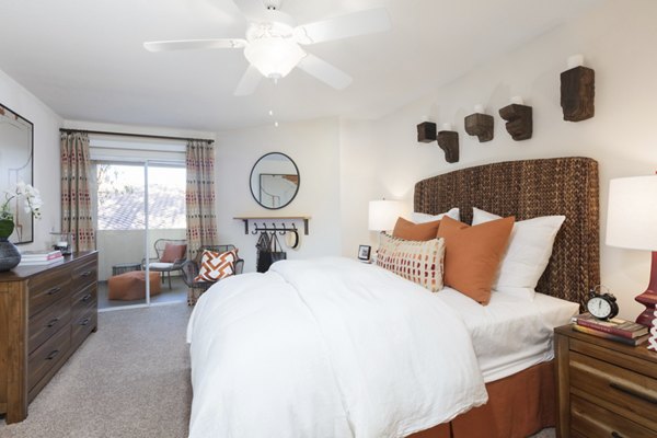 Cozy bedroom with modern decor and ample natural light at Barcelona Apartments, Greystar luxury community
