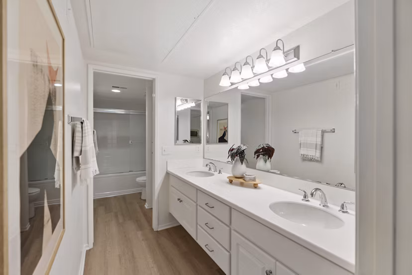Modern bathroom with marble countertops in Barcelona Apartments featuring luxury finishes