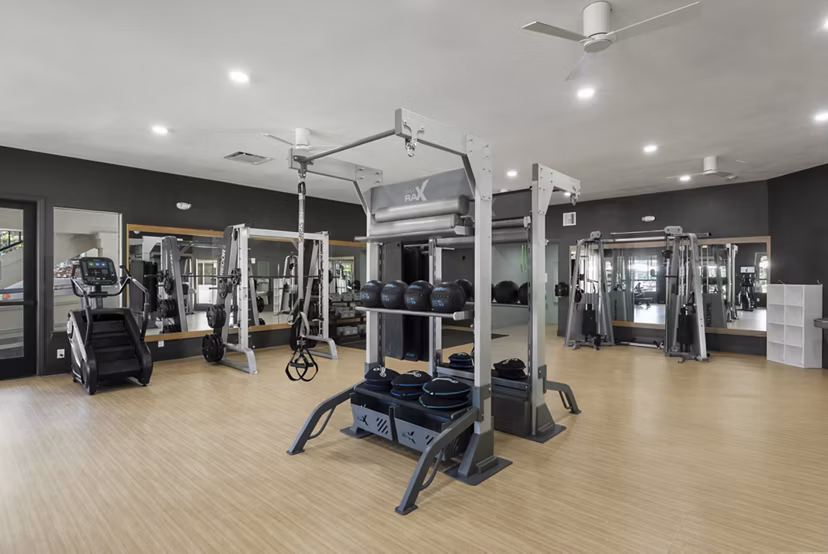 State-of-the-art fitness center with modern equipment at Barcelona Apartments