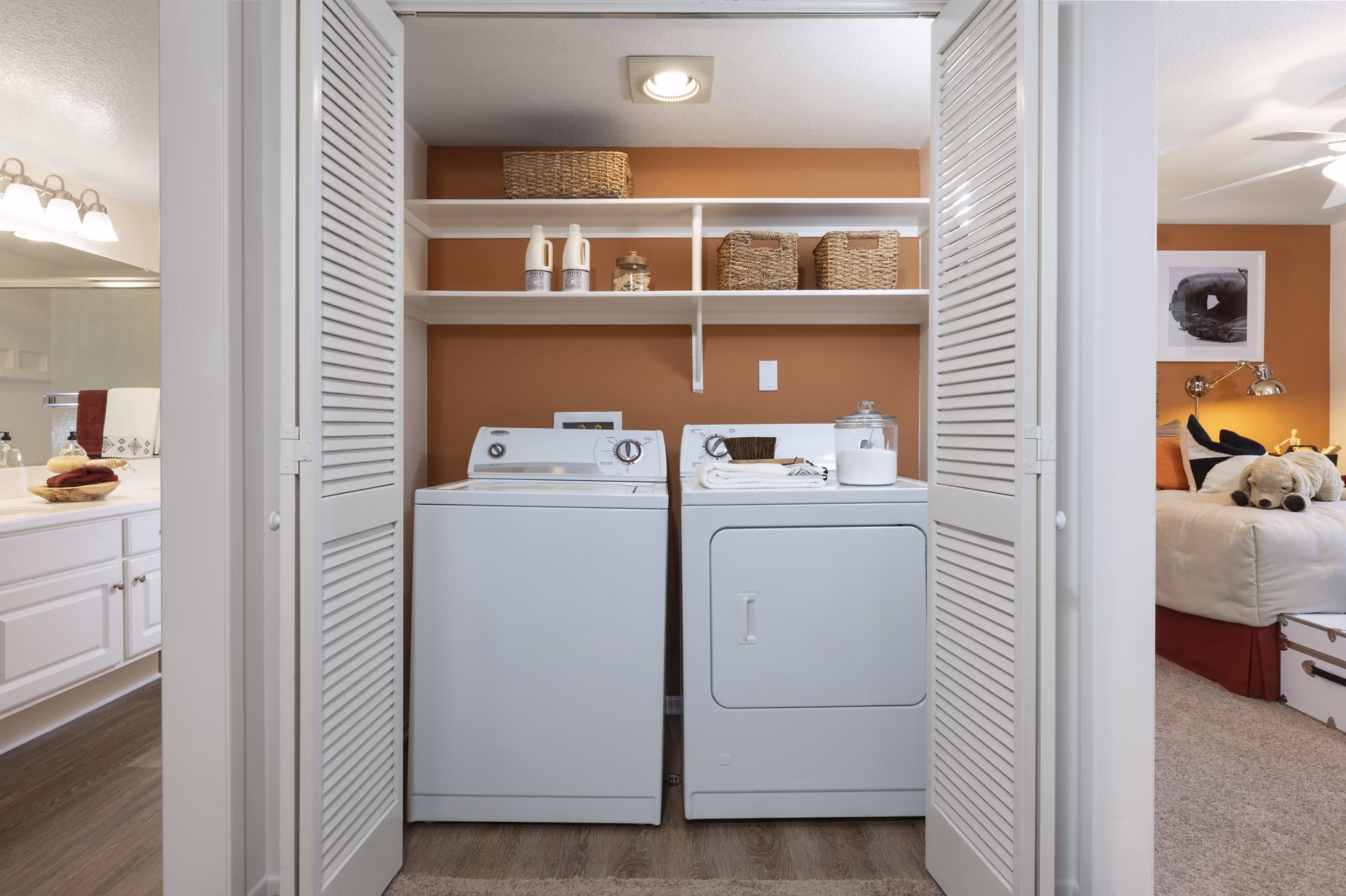Modern laundry room with stainless steel appliances at Barcelona Apartments, offering convenience for residents in premium luxury living
