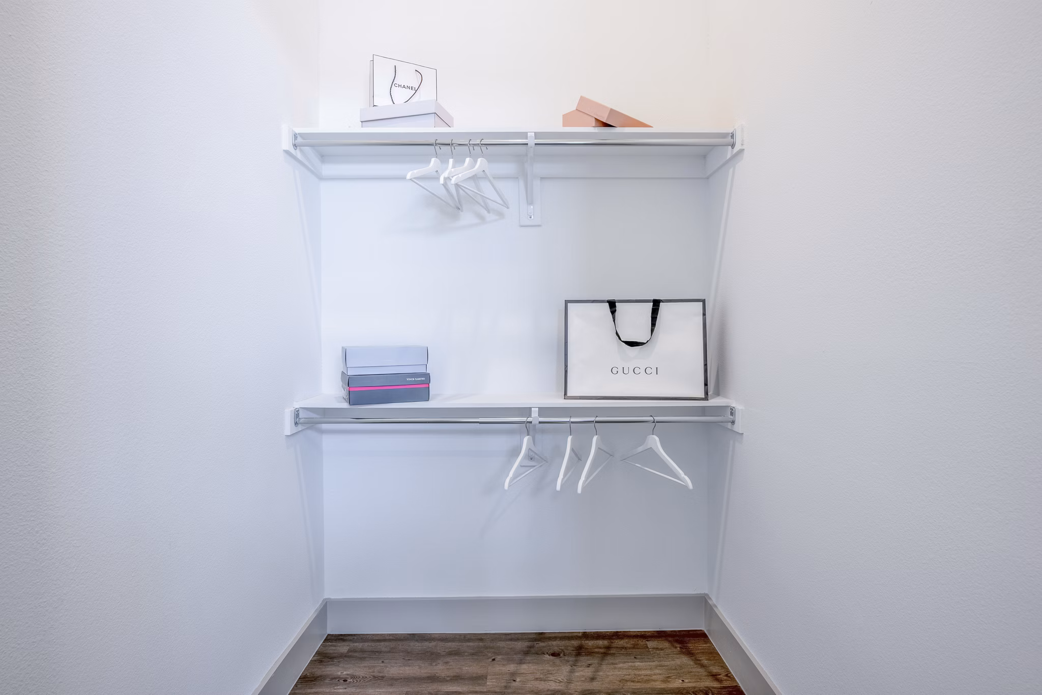 Walk-in closet with custom shelving in The Beverley at Denton Apartments