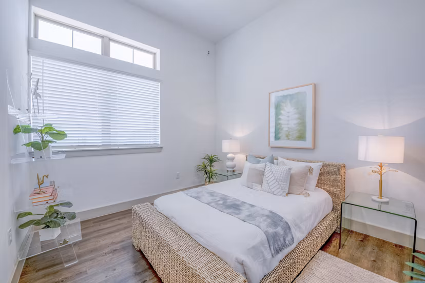 Spacious bedroom with contemporary decor at The Beverley at Denton Apartments, offering comfort and style