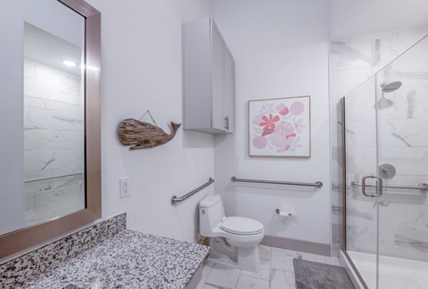 Luxurious bathroom with modern fixtures in The Beverley at Denton Apartments