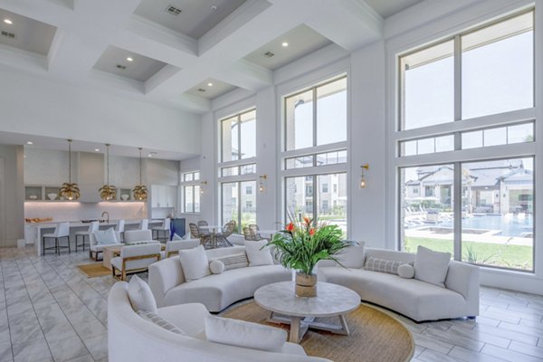 Clubhouse with modern seating and decor at The Mark at Denton Apartments, a Greystar luxury community