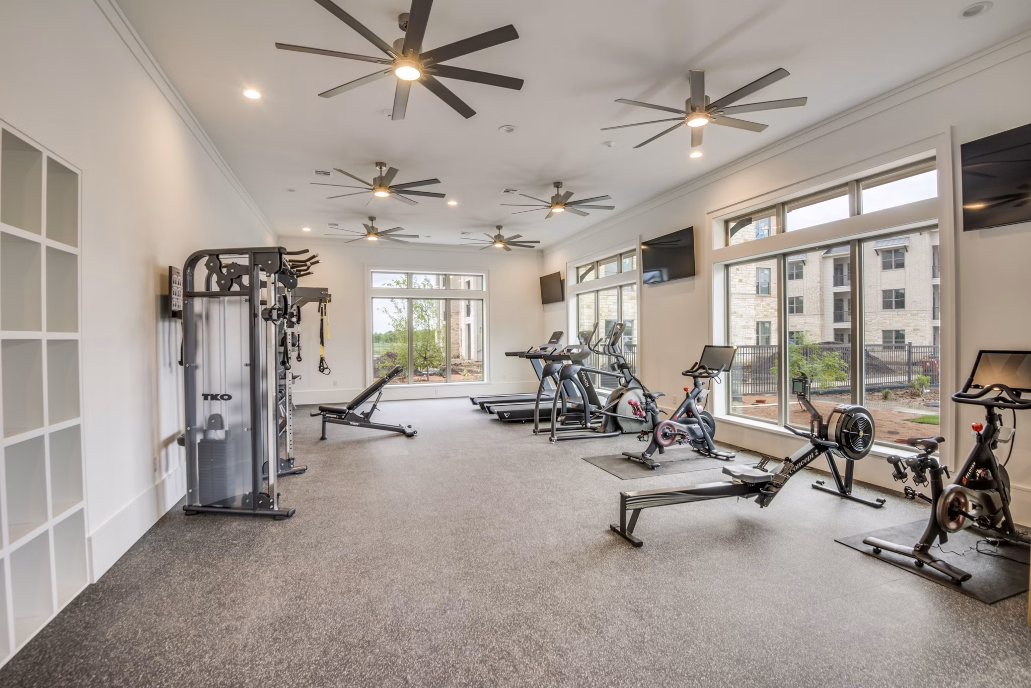 State-of-the-art fitness center featuring modern equipment at The Mark at Denton Apartments