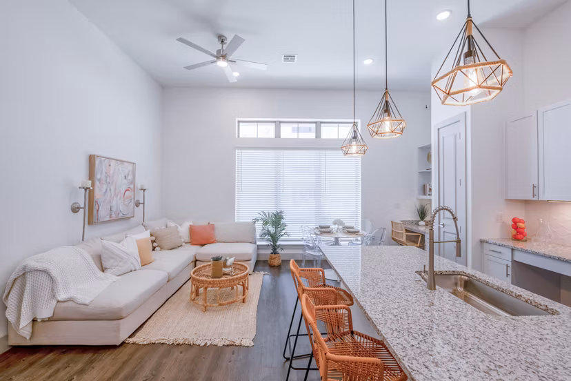 Modern kitchen with stainless steel appliances in The Beverley at Denton Apartments