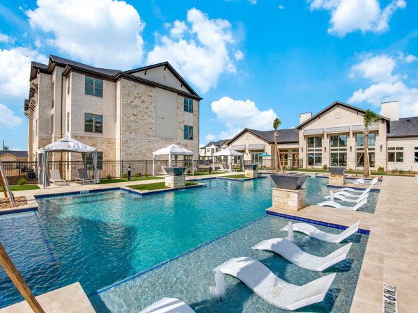 Inviting outdoor pool at The Mark at Denton Apartments, perfect for relaxation and leisure Enjoy luxury amenities in this beautiful community