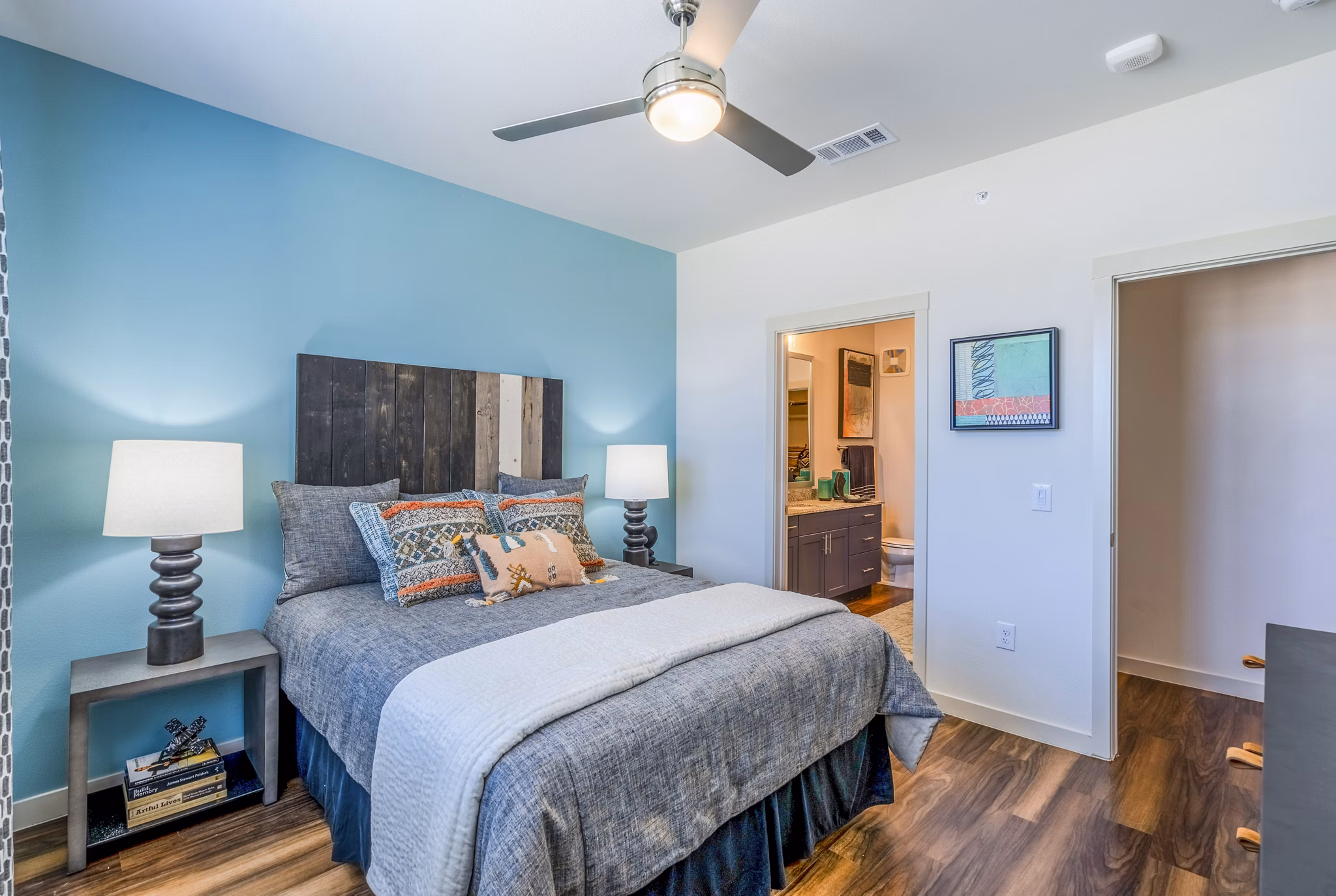 Cozy bedroom with modern decor at Prose Northbend Apartments, featuring luxurious furnishings and ambient lighting