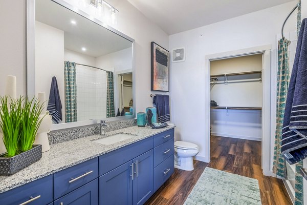 Bathroom with sleek vanity and modern fixtures at Prose Northbend Apartments, Greystar luxury community