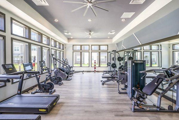 Modern fitness center at Prose Northbend Apartments featuring state-of-the-art equipment and training areas
