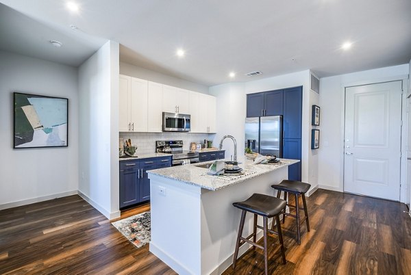 Modern kitchen with stainless steel appliances at Prose Northbend Apartments