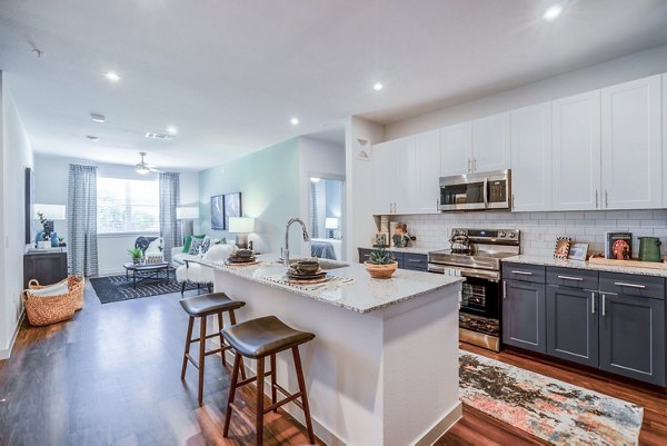 Modern kitchen with stainless steel appliances at Prose Northbend Apartments