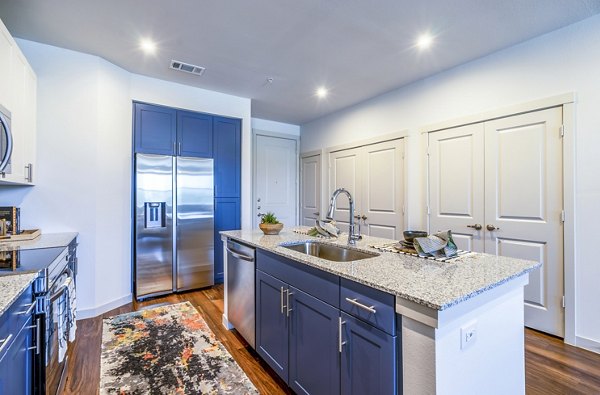 Modern kitchen with stainless steel appliances at Prose Northbend luxury apartments