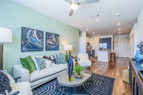 Spacious living room with modern decor and natural light in Prose Northbend Apartments luxury residences