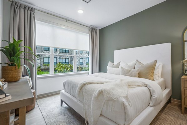 Spacious bedroom with modern decor at Enclave at Raritan Apartments, offering luxurious living spaces for comfort and relaxation