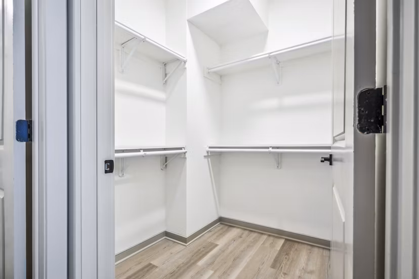 Walk-in closet with ample storage space in a bedroom at Enclave at Raritan Apartments