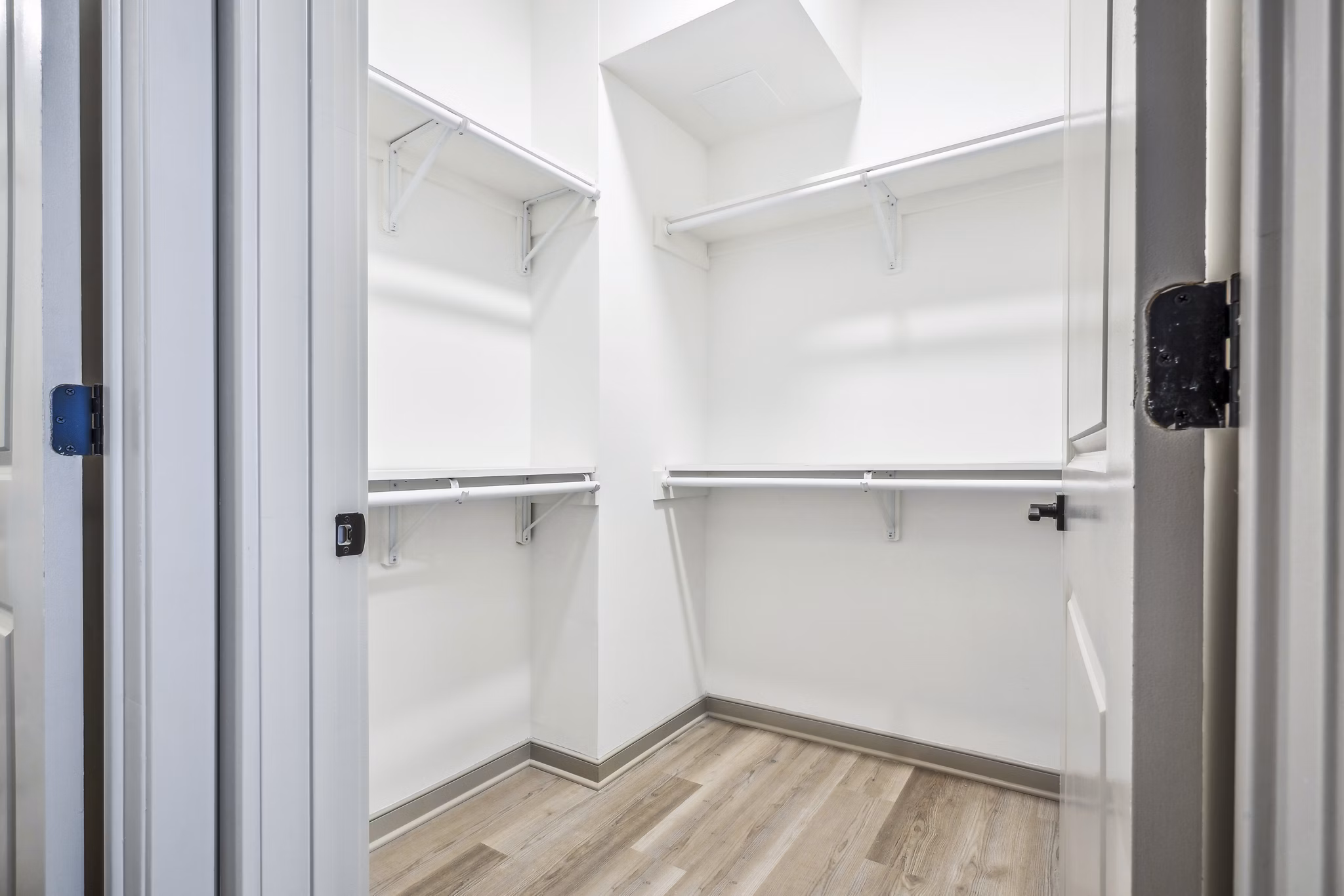 Walk-in closet with ample storage space in a bedroom at Enclave at Raritan Apartments