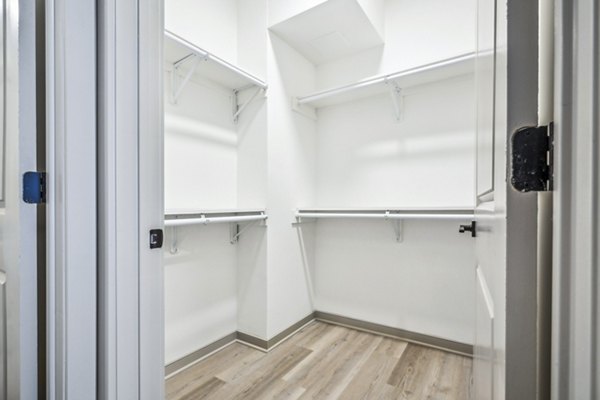 Walk-in closet with ample storage space in a bedroom at Enclave at Raritan Apartments