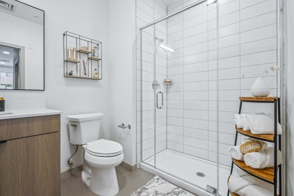 Enclave at Raritan Apartments: Modern bathroom with sleek fixtures and bright lighting