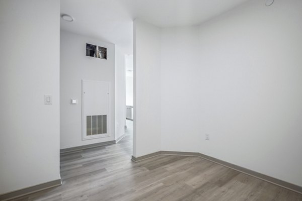 Dining room with elegant chandelier and modern furniture in Enclave at Raritan Apartments, a luxury community by Greystar