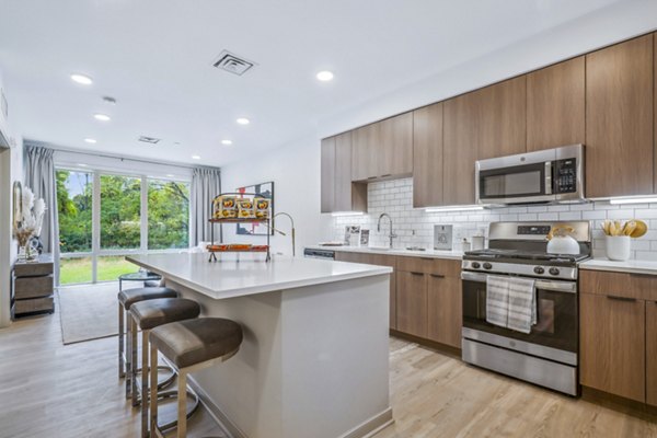 Modern kitchen with sleek countertops and stainless steel appliances at Enclave at Raritan Apartments Ideal for luxury living
