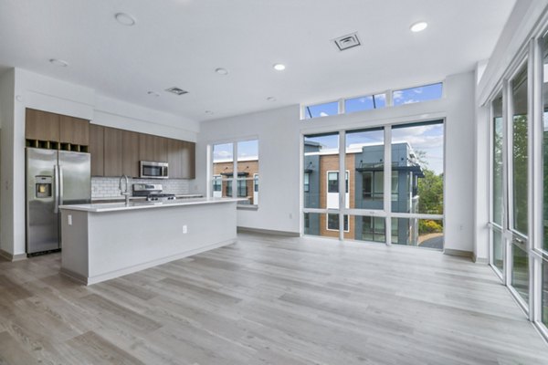 Modern kitchen with stainless steel appliances and granite countertops at Enclave at Raritan Apartments