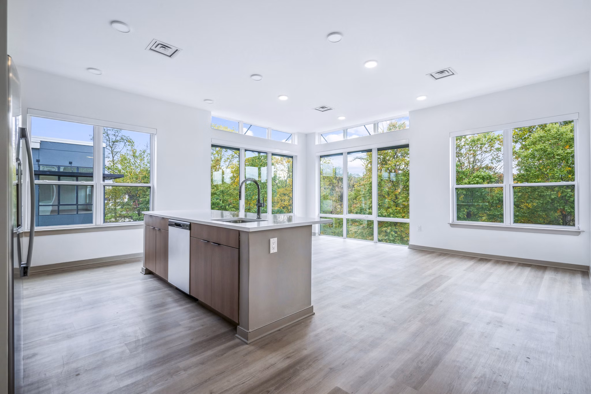 Contemporary kitchen with stainless steel appliances at Enclave at Raritan Apartments