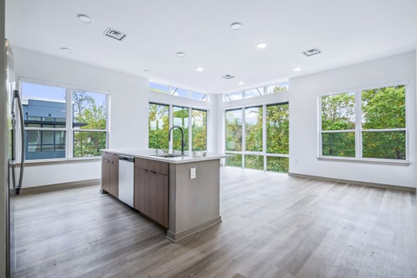 Contemporary kitchen with stainless steel appliances at Enclave at Raritan Apartments