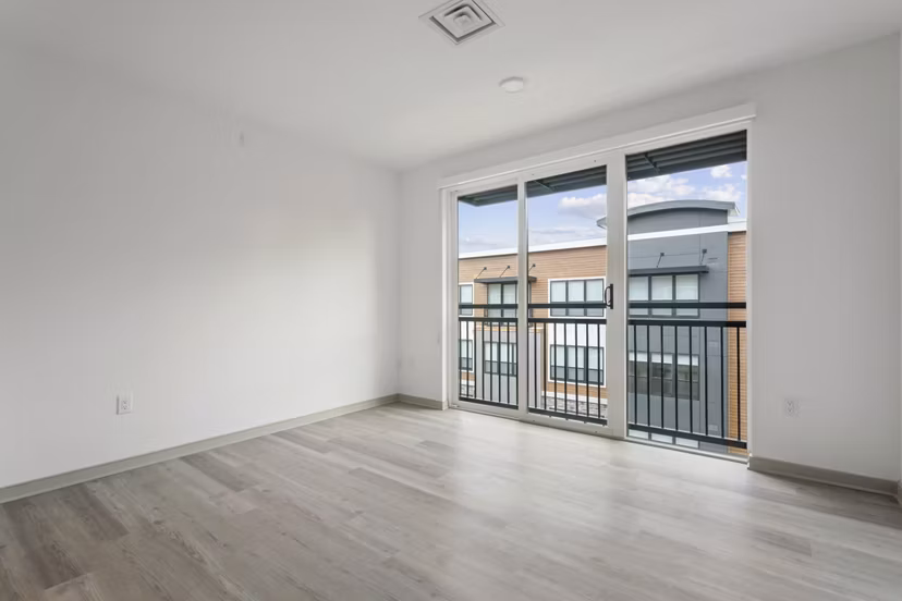 Open-concept living room with modern furnishings at Enclave at Raritan Apartments