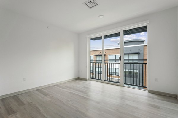 Open-concept living room with modern furnishings at Enclave at Raritan Apartments