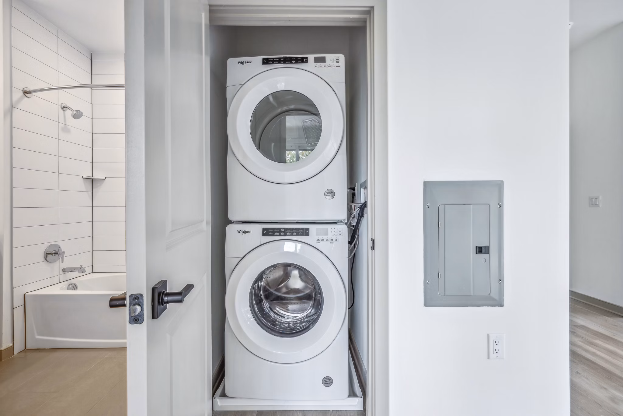 Laundry room with modern appliances at Enclave at Raritan Apartments