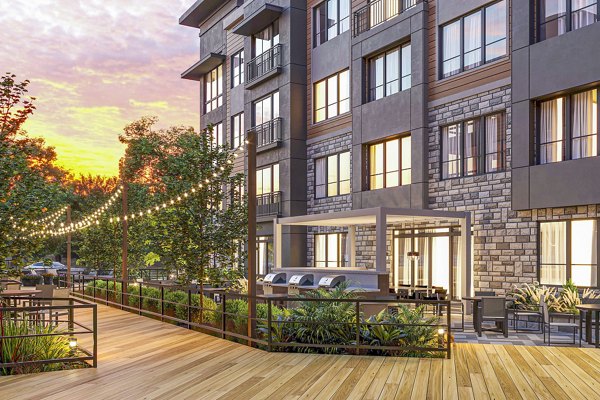 Grill area with outdoor seating at Enclave at Raritan Apartments Enjoy luxury amenities in a vibrant community setting