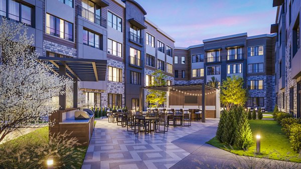 Outdoor grill area on a patio at Enclave at Raritan Apartments, perfect for social gatherings and community events