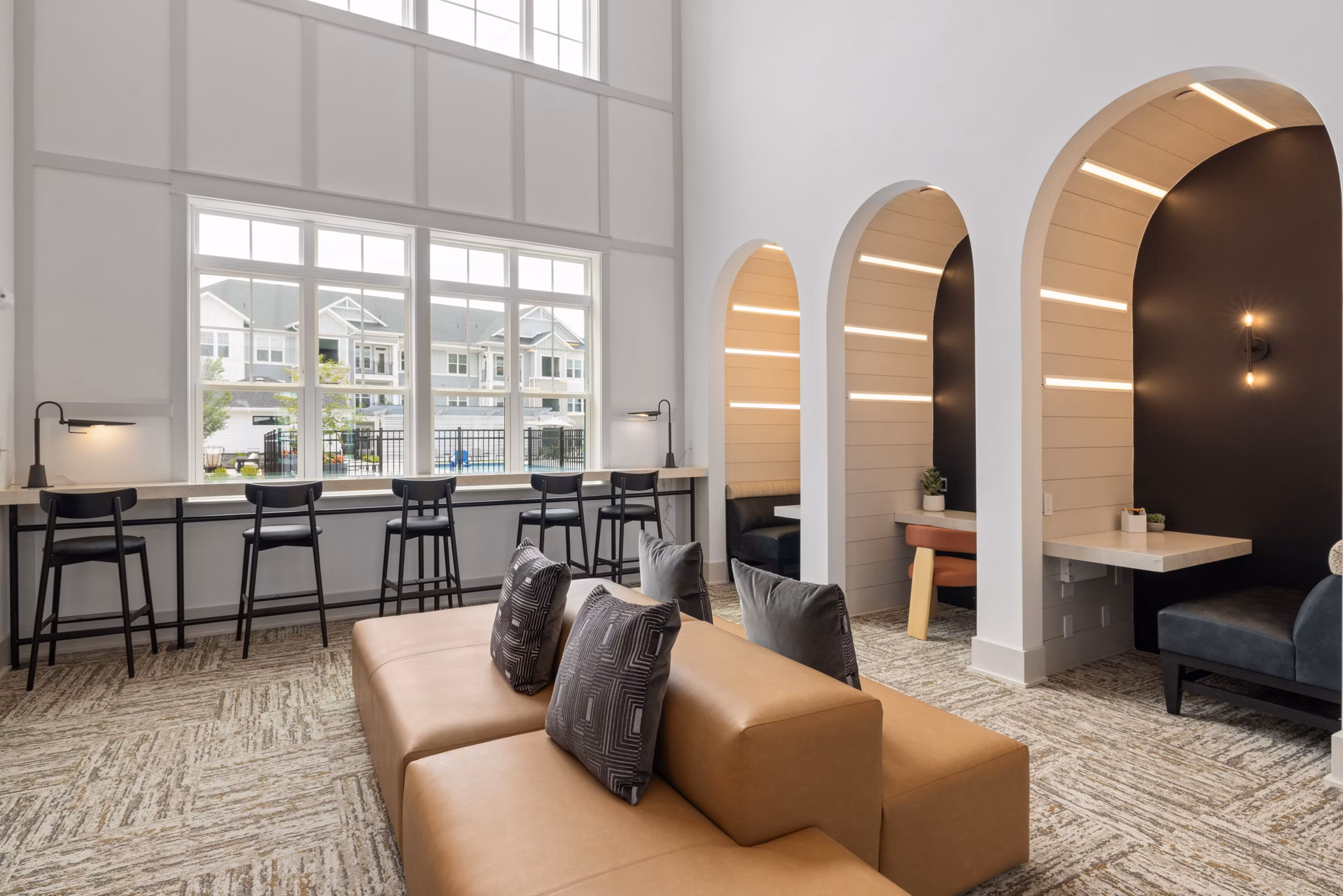 Luxurious clubhouse featuring modern decor and ample seating at The Lindley at Grove 98 Apartments