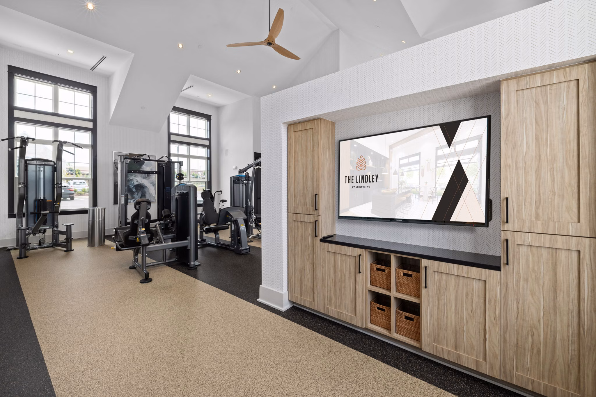 Fitness center with modern equipment at The Lindley at Grove 98 Apartments