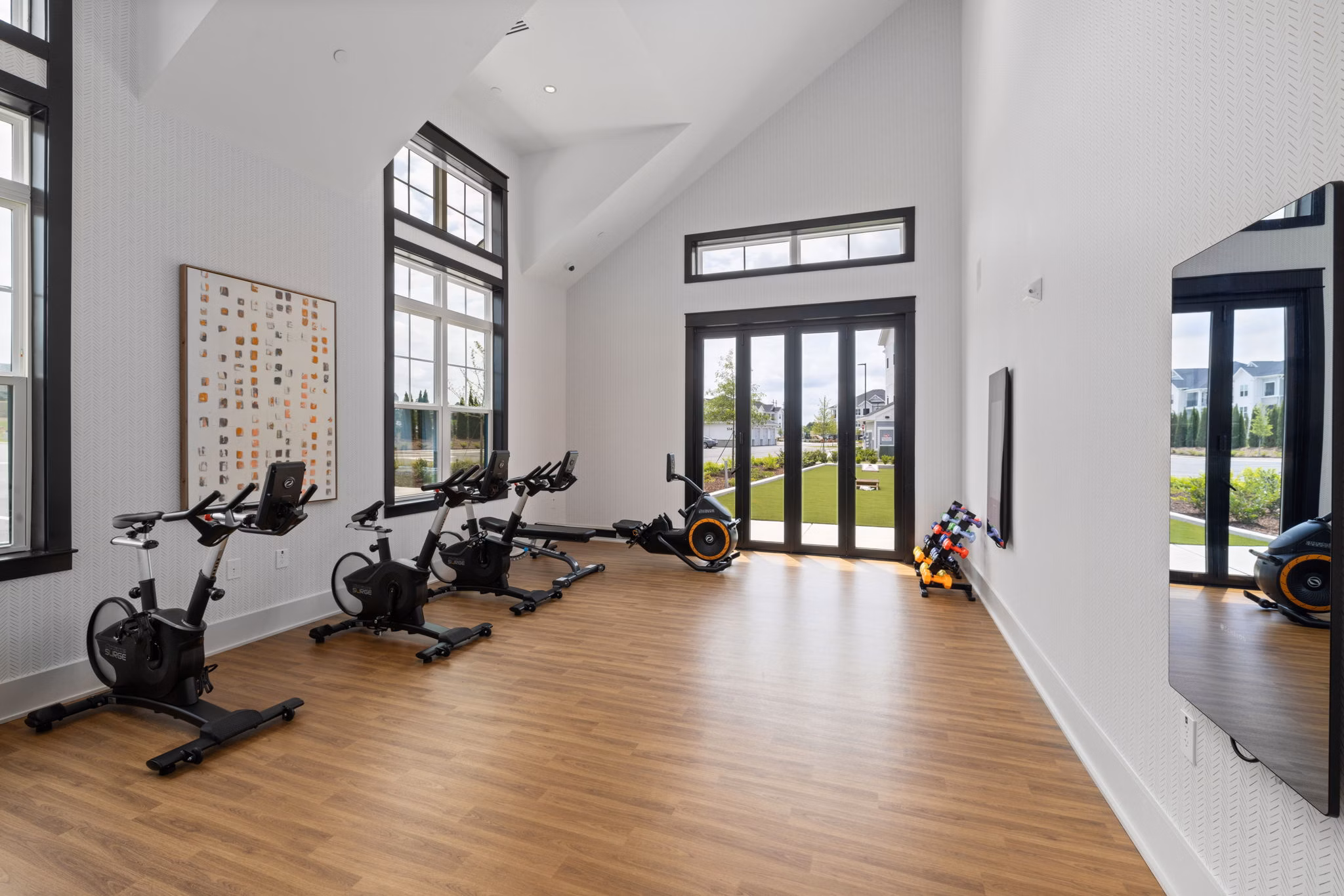 Yoga/spin studio featuring modern equipment at The Lindley at Grove 98 Apartments, ideal for fitness enthusiasts seeking an active lifestyle