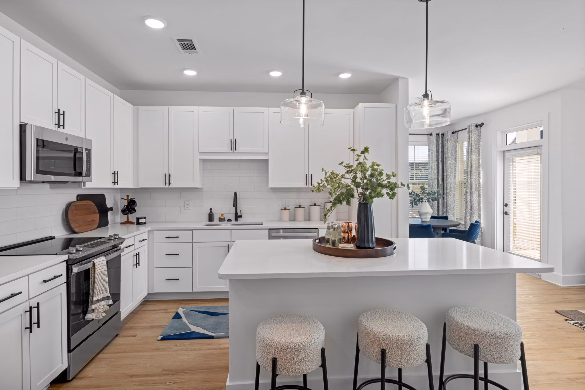 Modern kitchen with stainless steel appliances at Aventura Bellevue Apartments, luxury living by Greystar