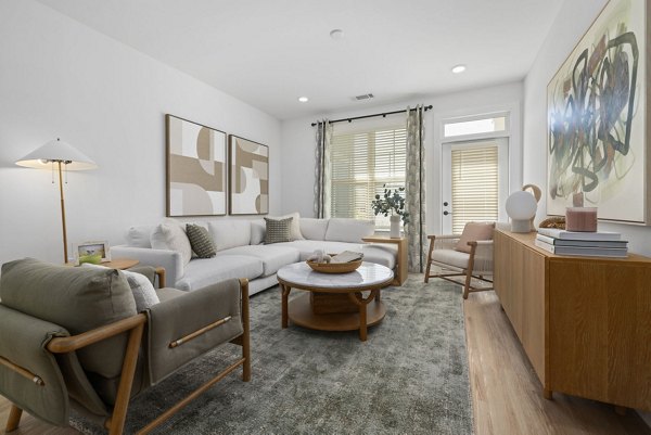 Modern living room with contemporary furnishings at The Lindley at Grove 98 Apartments