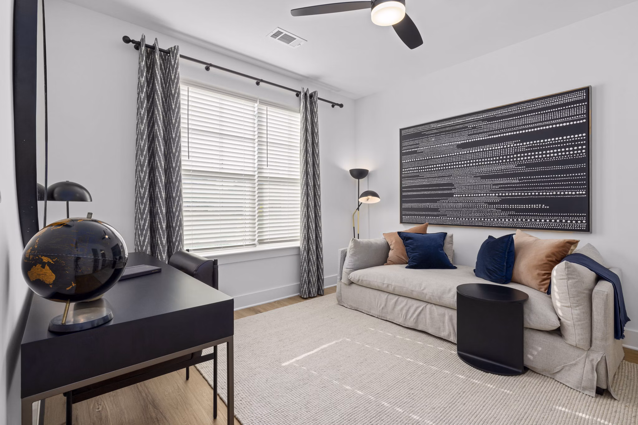 Spacious living room with modern furnishings in The Lindley at Grove 98 Apartments
