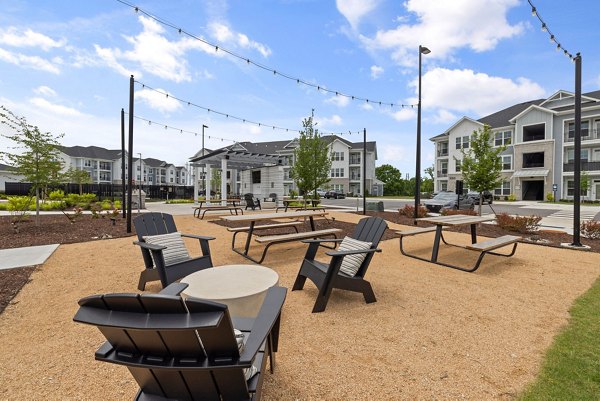 Courtyard featuring modern seating and lush landscaping at The Lindley at Grove 98 Apartments, luxury community living