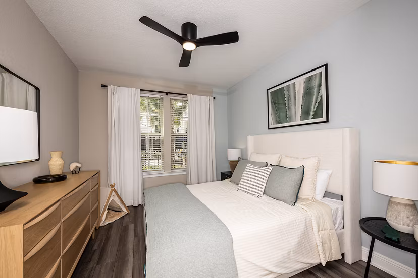Spacious bedroom with modern decor at The Village at Lake Lily Apartments