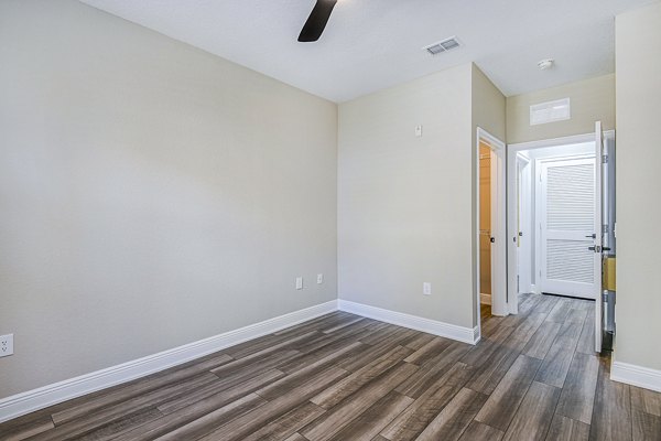 Spacious bedroom with modern decor at The Village at Lake Lily Apartments