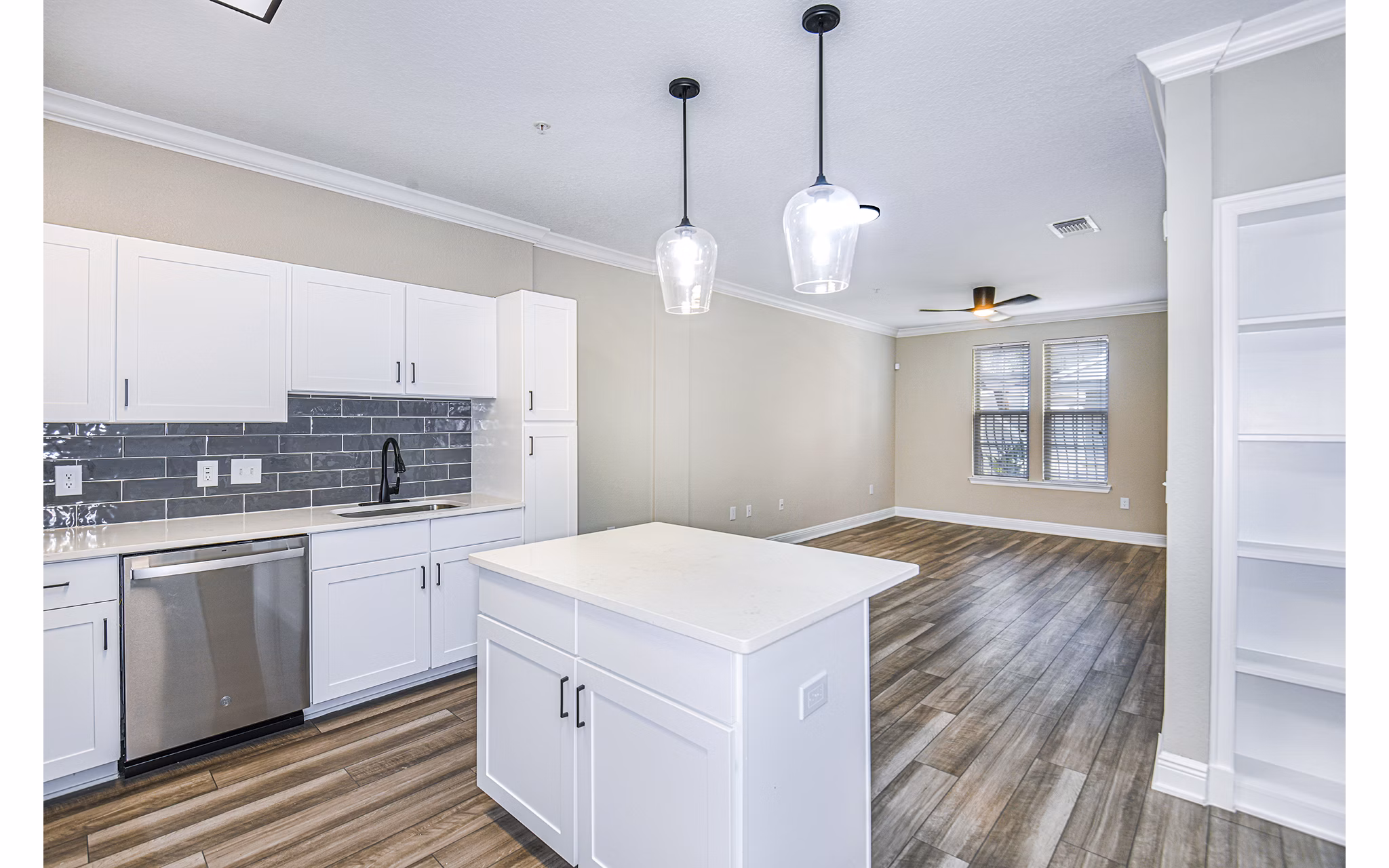 Spacious kitchen with modern appliances in The Village at Lake Lily Apartments