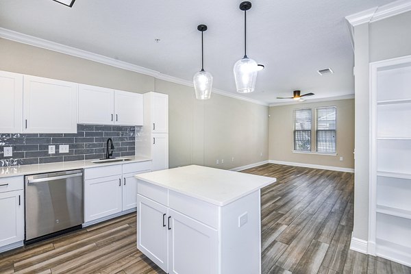 Spacious kitchen with modern appliances in The Village at Lake Lily Apartments