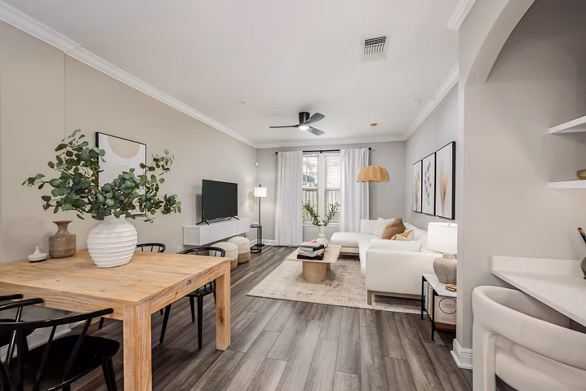 Spacious living room with modern decor at The Village at Lake Lily Apartments