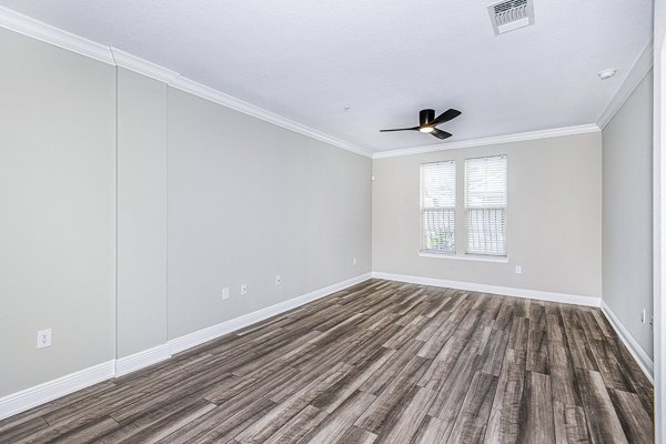 Spacious living room with modern decor at The Village at Lake Lily Apartments