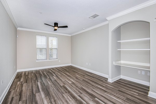 Living room and home office area featuring modern furniture at The Village at Lake Lily Apartments
